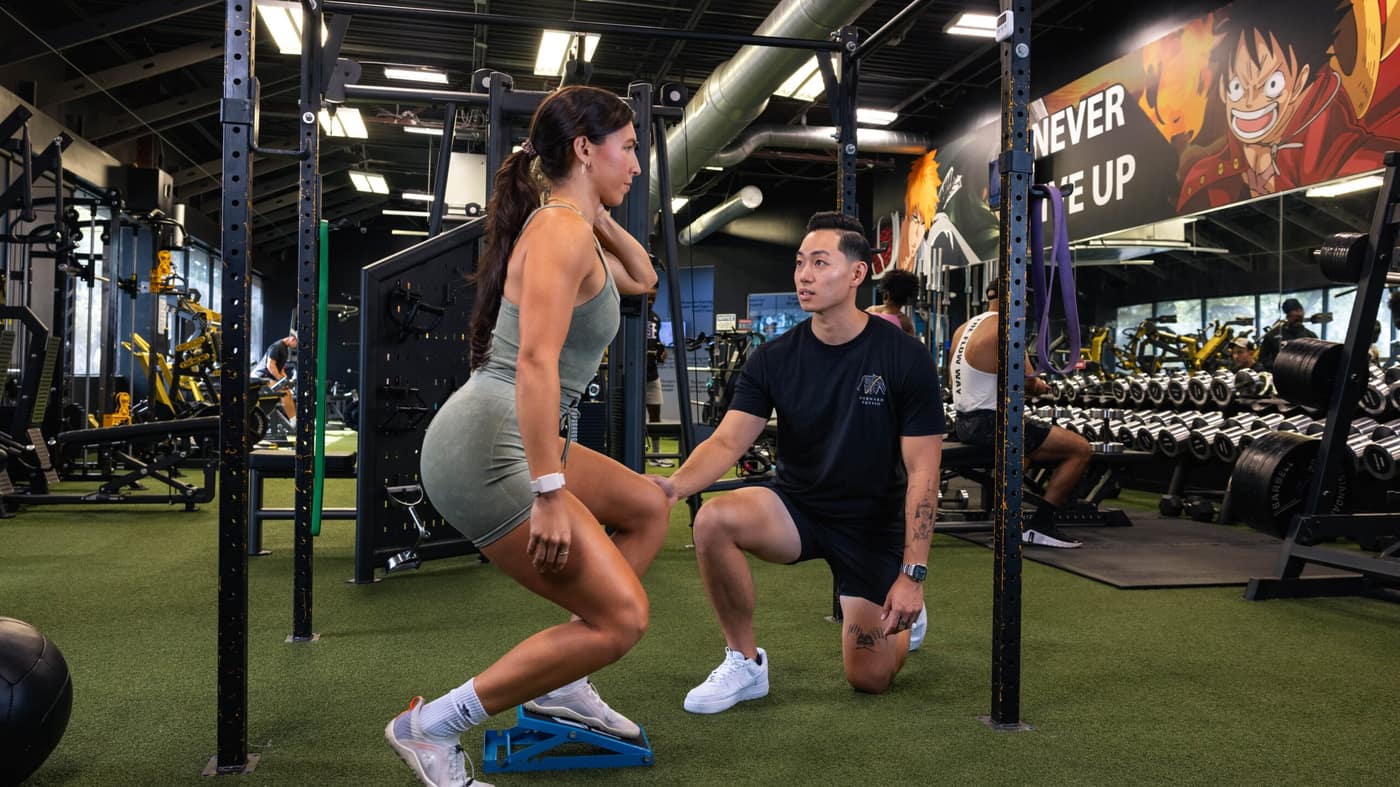 Forward Physio doctor of physical therapy coaching an athlete through a single-leg split squat — the hip and leg strength work that anchors IT band syndrome rehab in Tampa.